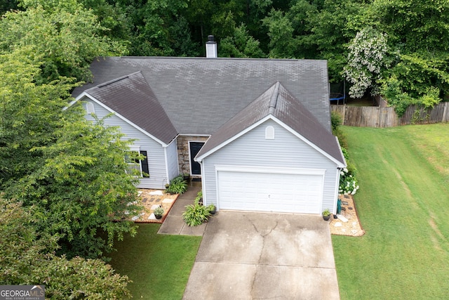 784 Crestworth Xing, Powder Springs, GA 30127 - view of front facade with concrete driveway, a chimney, roof with shingles, and an attached garage