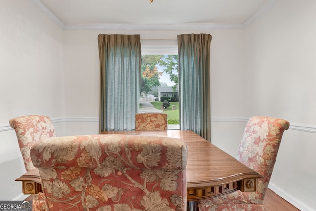 7972 Woods Ln, Jonesboro, GA 30236 - dining space featuring crown molding, wood finished floors, and baseboards