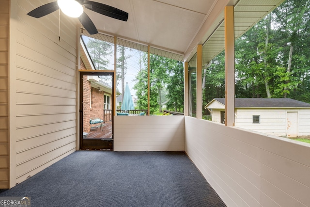 7972 Woods Ln, Jonesboro, GA 30236 - unfurnished sunroom with a ceiling fan