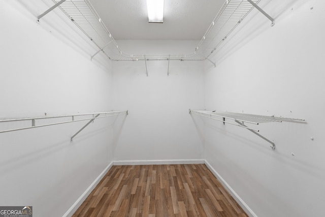 7972 Woods Ln, Jonesboro, GA 30236 - walk in closet featuring wood finished floors