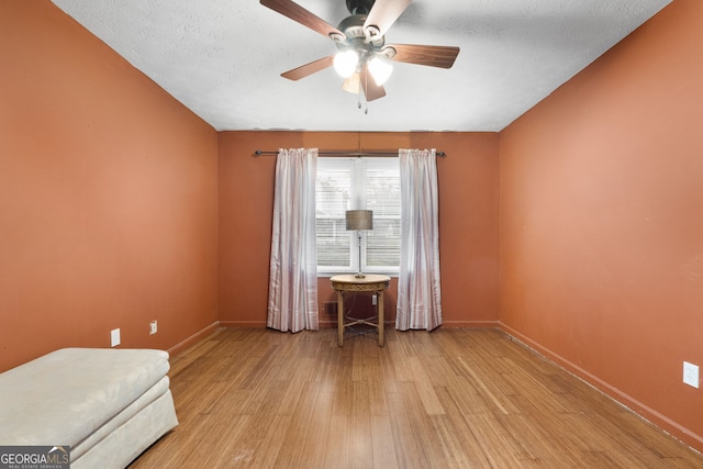 7972 Woods Ln, Jonesboro, GA 30236 - unfurnished room with wood finished floors, ceiling fan, and baseboards