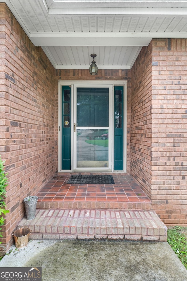 7972 Woods Ln, Jonesboro, GA 30236 - doorway to property with brick siding