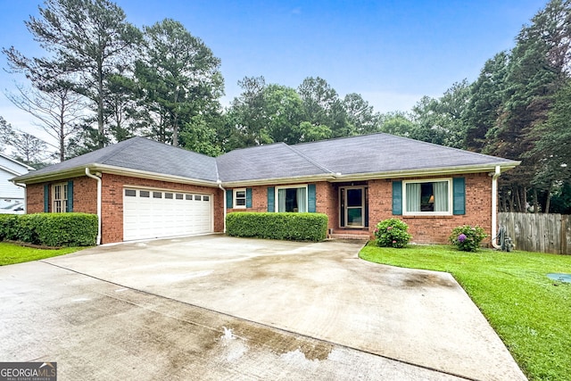 7972 Woods Ln, Jonesboro, GA 30236 - single story home featuring brick siding, an attached garage, and driveway