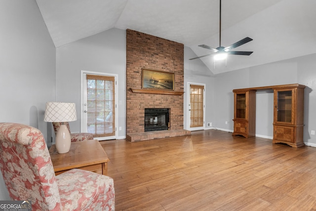 7972 Woods Ln, Jonesboro, GA 30236 - living room featuring ceiling fan, plenty of natural light, light wood-type flooring, and high vaulted ceiling
