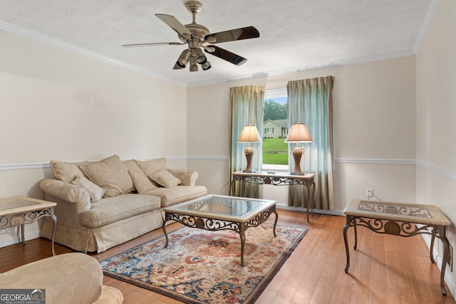 7972 Woods Ln, Jonesboro, GA 30236 - living area with a ceiling fan, wood finished floors, ornamental molding, and a textured ceiling