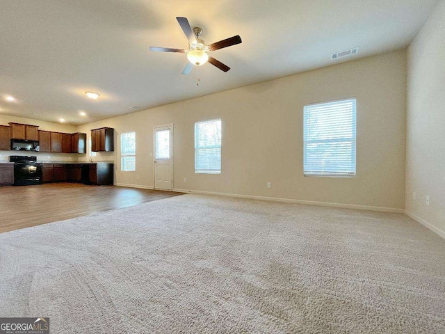 279 Darling Ln, Pendergrass, GA 30567 - unfurnished living room featuring light colored carpet, a ceiling fan, and recessed lighting