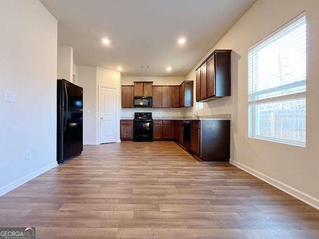279 Darling Ln, Pendergrass, GA 30567 - kitchen featuring black appliances, light wood-type flooring, light countertops, and recessed lighting