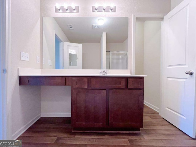 279 Darling Ln, Pendergrass, GA 30567 - full bath with wood finished floors, vanity, and a shower with door