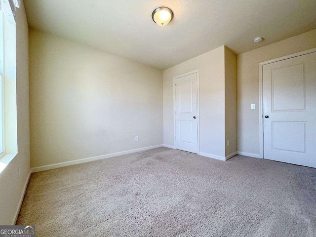 279 Darling Ln, Pendergrass, GA 30567 - unfurnished bedroom featuring carpet and baseboards