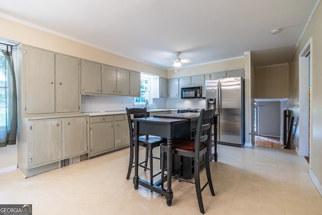 1236 S Shadygrove Ct, Stone Mountain, GA 30083 - kitchen with stainless steel fridge, black microwave, a ceiling fan, gray cabinetry, and crown molding