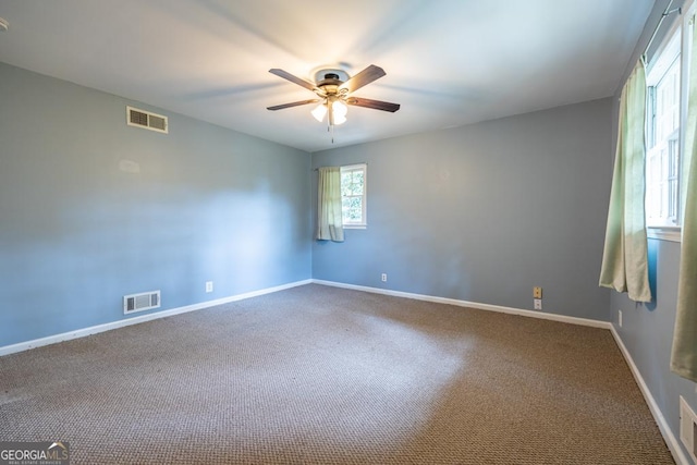 1236 S Shadygrove Ct, Stone Mountain, GA 30083 - carpeted empty room featuring a ceiling fan and baseboards