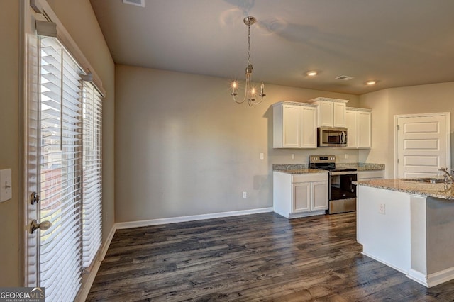 237 Cranapple Ln, Mcdonough, GA 30253 - kitchen with appliances with stainless steel finishes, dark wood-type flooring, a chandelier, white cabinets, and baseboards