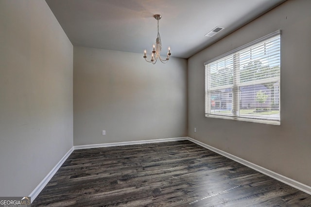 237 Cranapple Ln, Mcdonough, GA 30253 - unfurnished room featuring a chandelier, dark wood finished floors, and baseboards