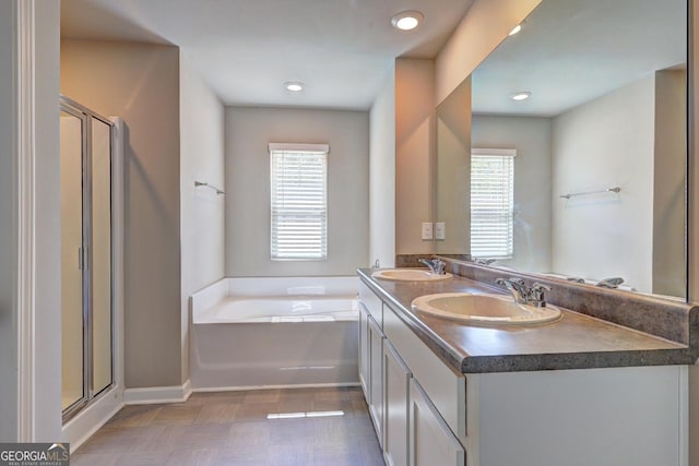 237 Cranapple Ln, Mcdonough, GA 30253 - full bath with a garden tub, plenty of natural light, a stall shower, and double vanity