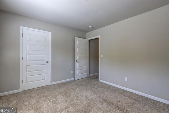 237 Cranapple Ln, Mcdonough, GA 30253 - unfurnished bedroom with carpet and baseboards
