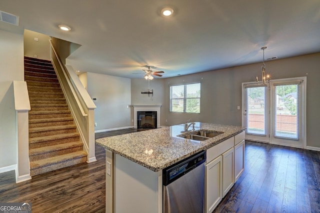 237 Cranapple Ln, Mcdonough, GA 30253 - kitchen with a sink, dishwasher, dark wood finished floors, ceiling fan, and light stone counters