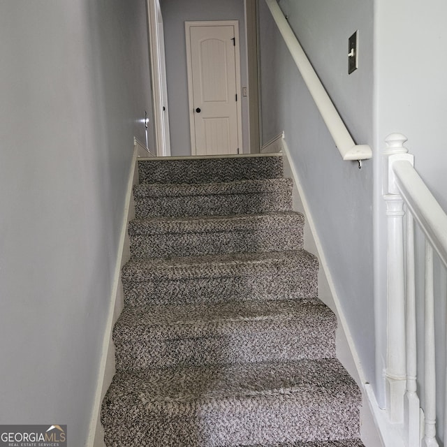 1649 Deer Creek Ln, Monroe, GA 30655 - stairway with baseboards