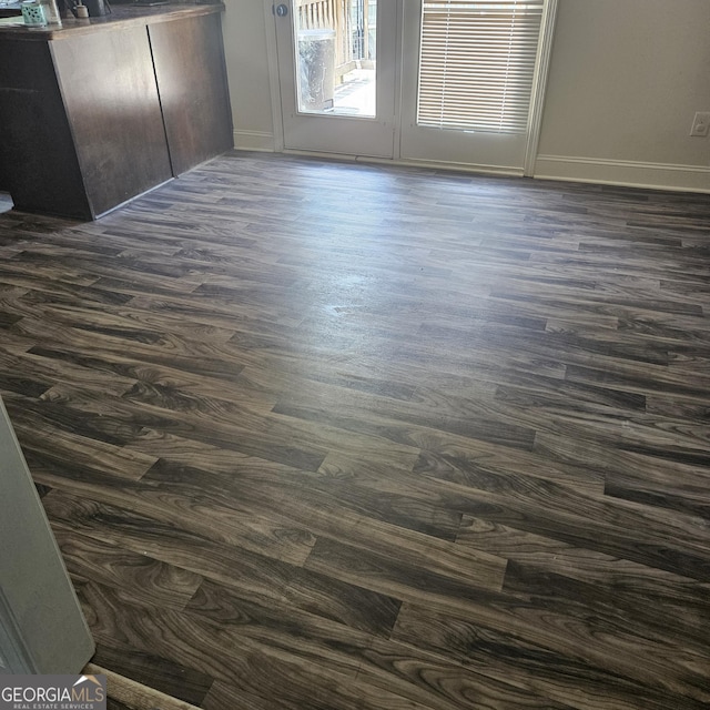 1649 Deer Creek Ln, Monroe, GA 30655 - spare room featuring dark wood-type flooring