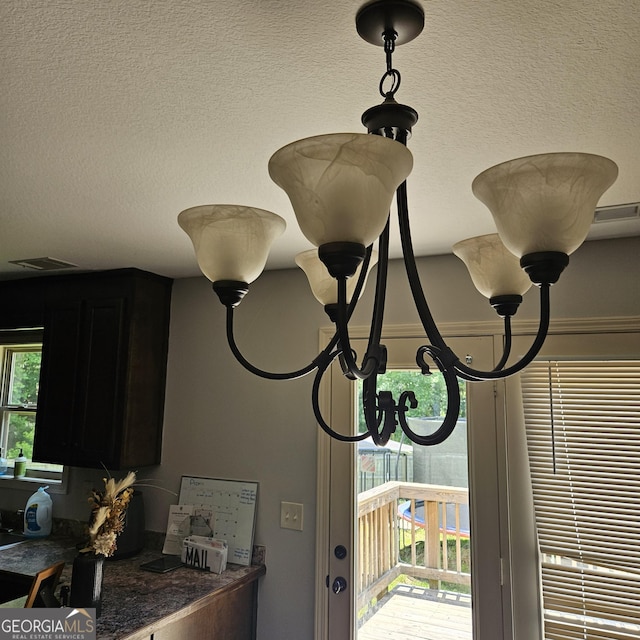 1649 Deer Creek Ln, Monroe, GA 30655 - detailed view of a textured ceiling and a chandelier