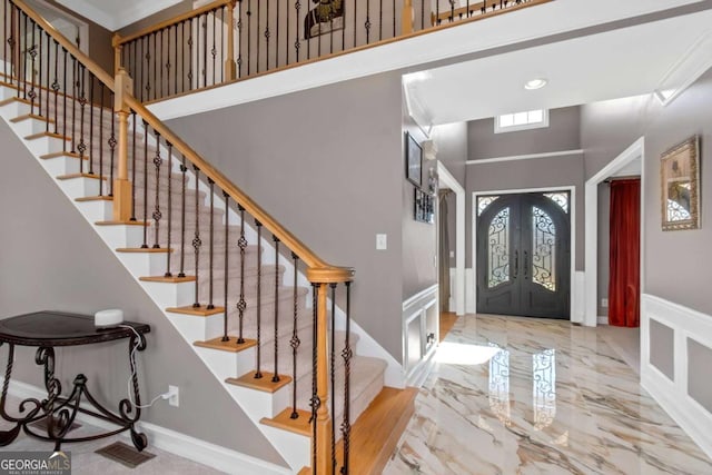 5810 Old Mill Trce, Lithonia, GA 30038 - foyer featuring a high ceiling, wainscoting, stairs, a decorative wall, and recessed lighting