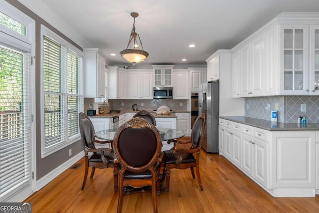 5810 Old Mill Trce, Lithonia, GA 30038 - kitchen with stainless steel appliances, white cabinets, light wood finished floors, and recessed lighting