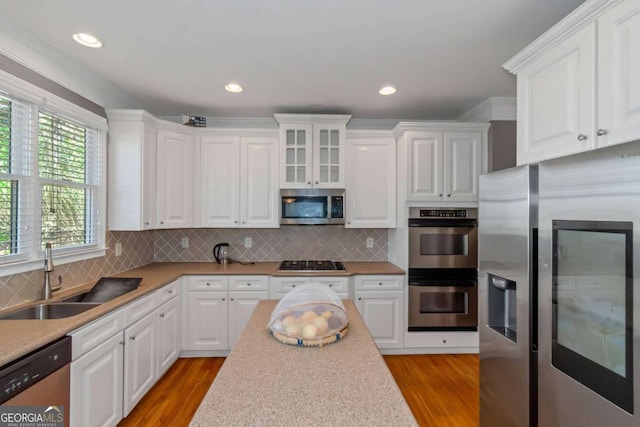 5810 Old Mill Trce, Lithonia, GA 30038 - kitchen with stainless steel appliances, a sink, white cabinetry, light wood finished floors, and recessed lighting