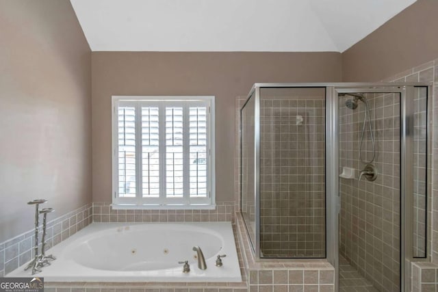 5810 Old Mill Trce, Lithonia, GA 30038 - bathroom featuring a stall shower, a jetted tub, and vaulted ceiling