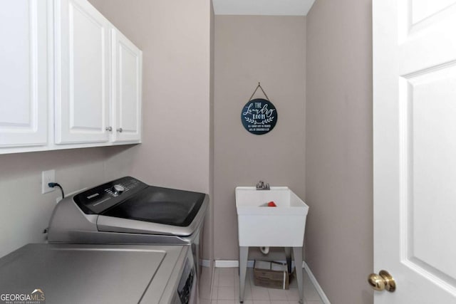 5810 Old Mill Trce, Lithonia, GA 30038 - laundry area with cabinet space, washing machine and dryer, baseboards, and light tile patterned floors