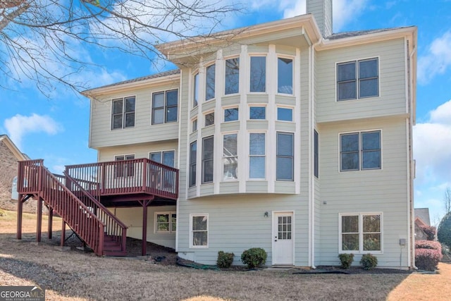 5810 Old Mill Trce, Lithonia, GA 30038 - rear view of house with a deck, a chimney, and stairs