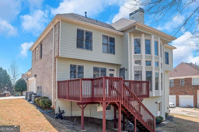 5810 Old Mill Trce, Lithonia, GA 30038 - rear view of property with a chimney, a deck, and stairway