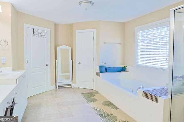 330 Bay Grove Rd, Loganville, GA 30052 - full bath featuring vanity, a garden tub, and an enclosed shower