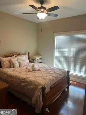 2594 Lassiter Rd, Forsyth, GA 31029 - bedroom with multiple windows, wood finished floors, and a ceiling fan