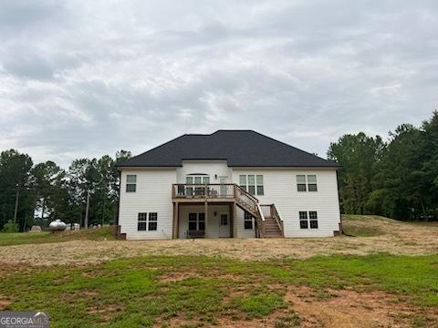 2594 Lassiter Rd, Forsyth, GA 31029 - rear view of house with stairs and a deck