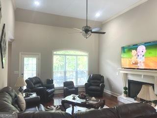 2594 Lassiter Rd, Forsyth, GA 31029 - living room featuring plenty of natural light, recessed lighting, wood finished floors, a ceiling fan, and ornamental molding