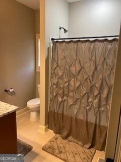 2594 Lassiter Rd, Forsyth, GA 31029 - full bath featuring vanity, toilet, wood finished floors, and curtained shower