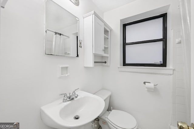 330 3rd St NE Apt 1, Atlanta, GA 30308 - bathroom featuring a sink and curtained shower