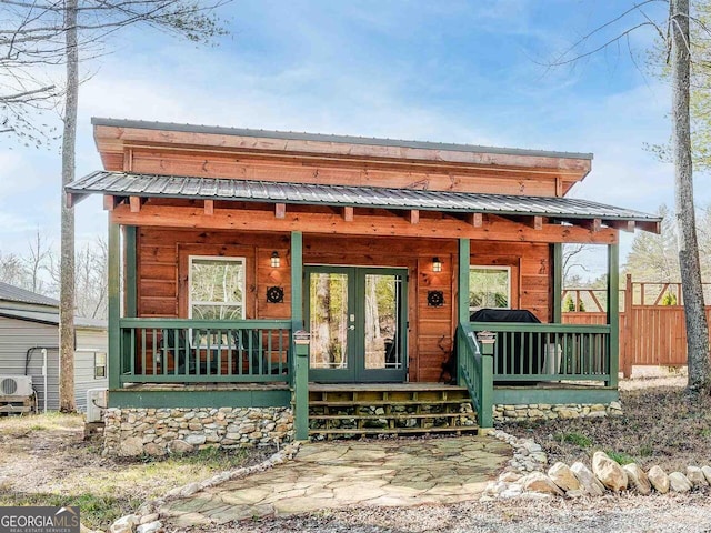 721 Dial Rd, Blue Ridge, GA 30513 - view of front of home with french doors, covered porch, and metal roof