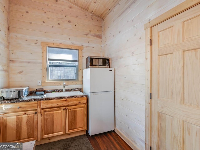 721 Dial Rd, Blue Ridge, GA 30513 - kitchen featuring freestanding refrigerator, stainless steel microwave, a sink, wood walls, and lofted ceiling
