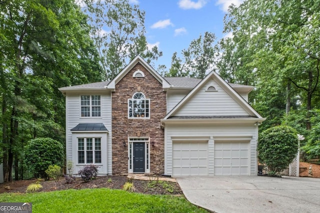 125 Sable Pointe Dr, Milton, GA 30004 - view of front of home with stone siding, concrete driveway, and a garage