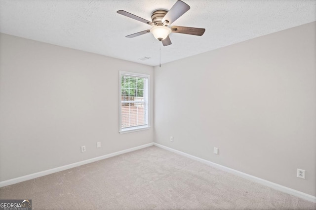 125 Sable Pointe Dr, Milton, GA 30004 - spare room with ceiling fan, baseboards, carpet floors, and a textured ceiling