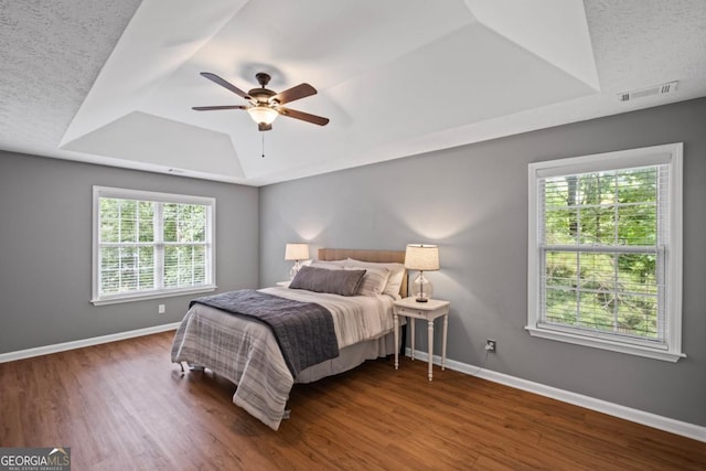 125 Sable Pointe Dr, Milton, GA 30004 - bedroom featuring a raised ceiling, wood finished floors, baseboards, and ceiling fan