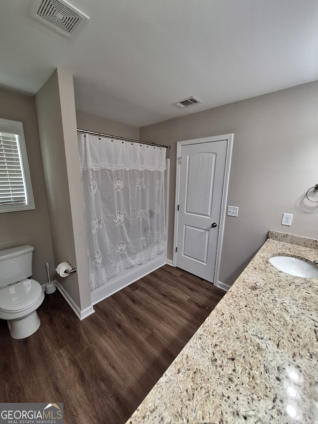 489 Asbury Mill Rd, Cleveland, GA 30528 - bathroom with toilet, wood finished floors, vanity, and baseboards