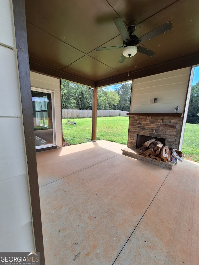 489 Asbury Mill Rd, Cleveland, GA 30528 - view of patio / terrace with ceiling fan and an outdoor stone fireplace