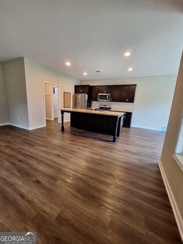 489 Asbury Mill Rd, Cleveland, GA 30528 - kitchen with appliances with stainless steel finishes, baseboards, dark wood finished floors, light countertops, and recessed lighting