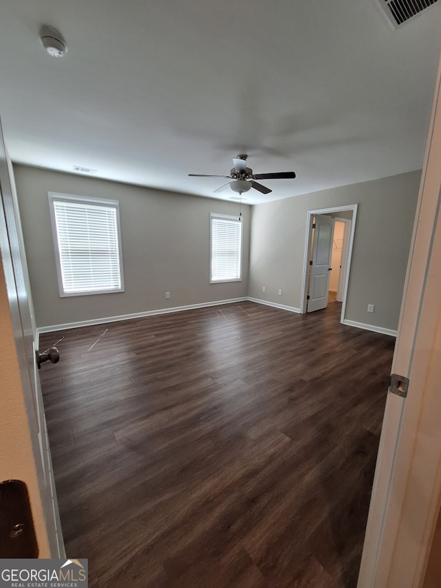 489 Asbury Mill Rd, Cleveland, GA 30528 - unfurnished room featuring baseboards, dark wood-style flooring, ceiling fan, and a smoke detector