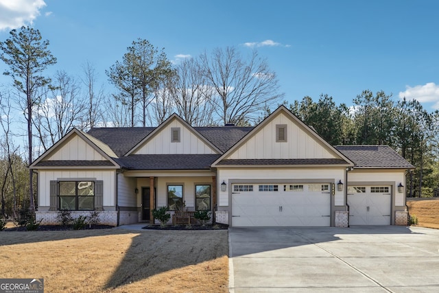 2441 Waterside Dr, Monroe, GA 30655 - modern farmhouse style home featuring a garage, concrete driveway, board and batten siding, and roof with shingles