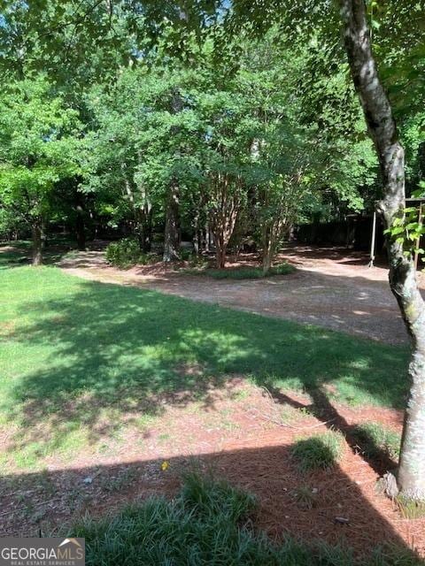 304 Tunis Rd, Mcdonough, GA 30253 - view of grassy yard featuring a patio
