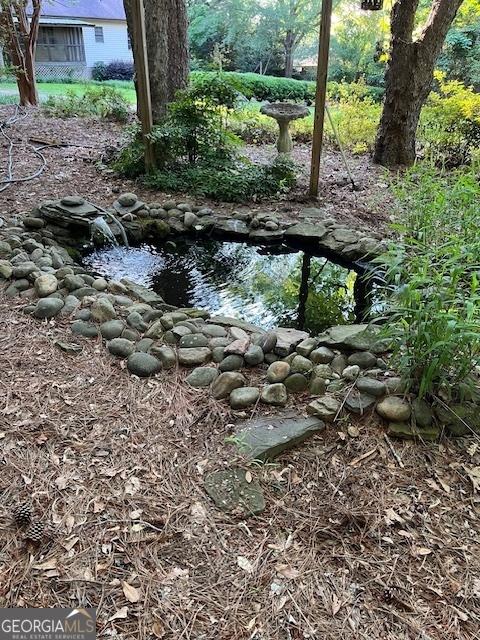 304 Tunis Rd, Mcdonough, GA 30253 - view of undeveloped land featuring a garden pond
