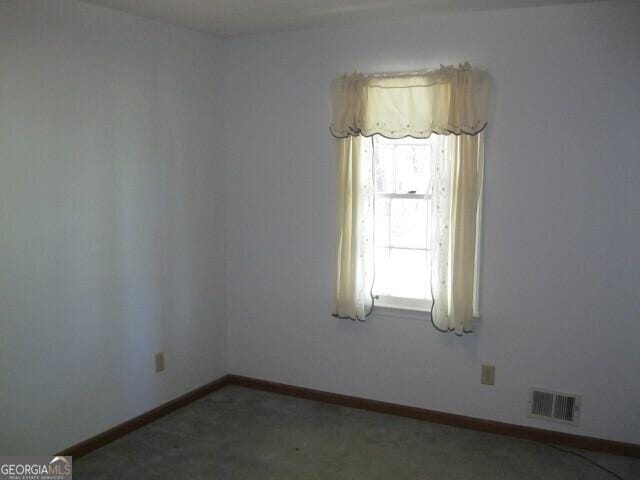 304 Tunis Rd, Mcdonough, GA 30253 - empty room featuring baseboards