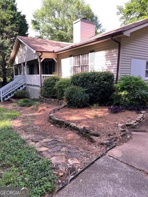 304 Tunis Rd, Mcdonough, GA 30253 - view of front of home featuring a chimney and covered porch